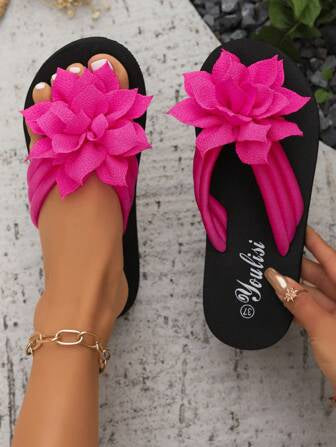 Pink and black slippers